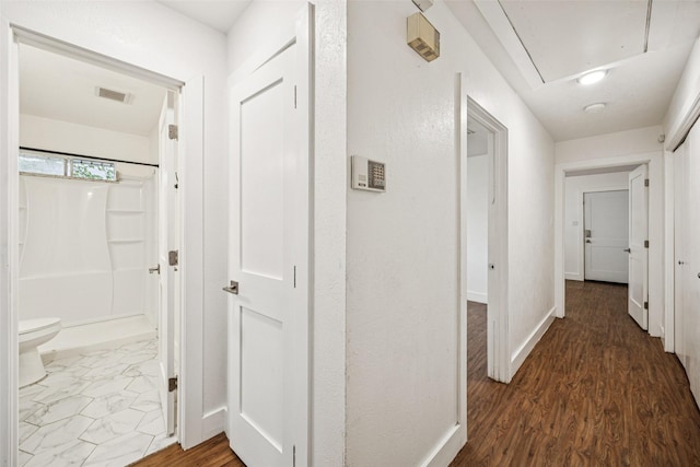 2529 W 12th St, Dallas, TX 75211 - corridor with attic access and wood finished floors