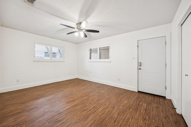 2529 W 12th St, Dallas, TX 75211 - empty room with ceiling fan and dark wood-style floors