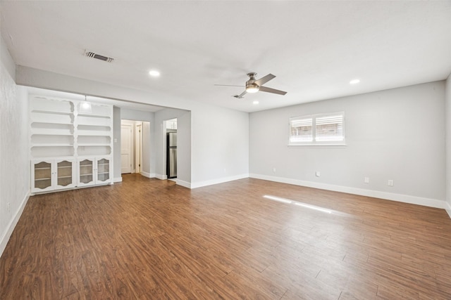 2529 W 12th St, Dallas, TX 75211 - unfurnished living room with a ceiling fan, wood finished floors, and recessed lighting