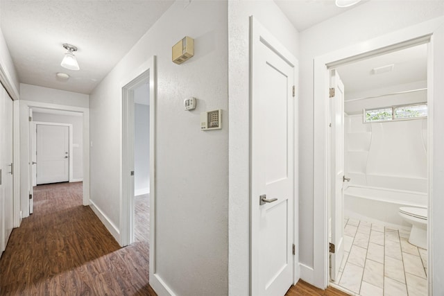 2529 W 12th St, Dallas, TX 75211 - hallway with wood finished floors and baseboards
