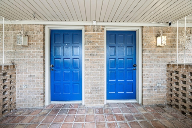 2529 W 12th St, Dallas, TX 75211 - property entrance featuring brick siding and a surveillance system