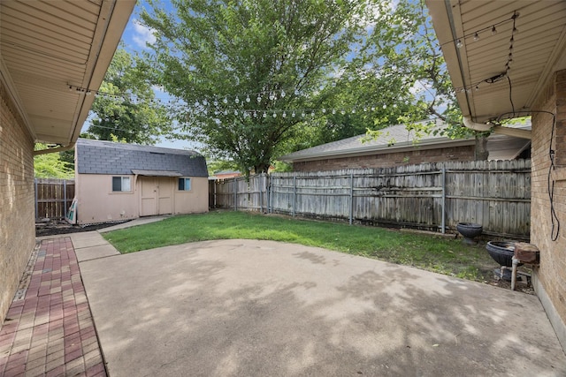 2529 W 12th St, Dallas, TX 75211 - fenced backyard with a patio and an outbuilding