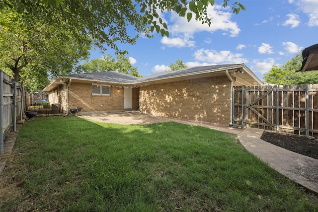 2529 W 12th St, Dallas, TX 75211 - rear view of property with brick siding, a fenced backyard, a patio, and a gate