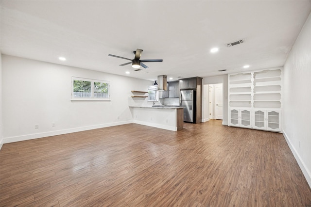 2529 W 12th St, Dallas, TX 75211 - unfurnished living room with a ceiling fan, dark wood-style floors, and recessed lighting