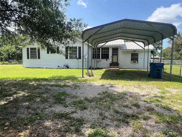 717 N 37th St, Corsicana, TX 75110 - view of vehicle parking with a detached carport, entry steps, and driveway