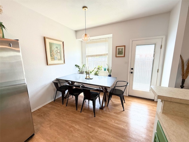 3541 Cripple Creek Trl, Fort Worth, TX 76262 - dining space featuring light wood-style floors and baseboards