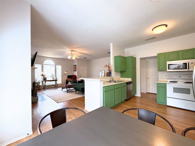 3541 Cripple Creek Trl, Fort Worth, TX 76262 - kitchen featuring green cabinets, white electric stove, dishwasher, a ceiling fan, and light wood-style flooring