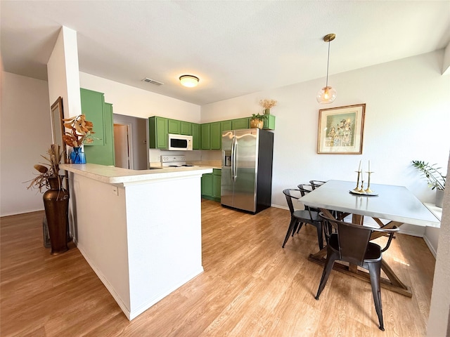 3541 Cripple Creek Trl, Fort Worth, TX 76262 - kitchen with green cabinetry, white appliances, light wood-style flooring, and a peninsula