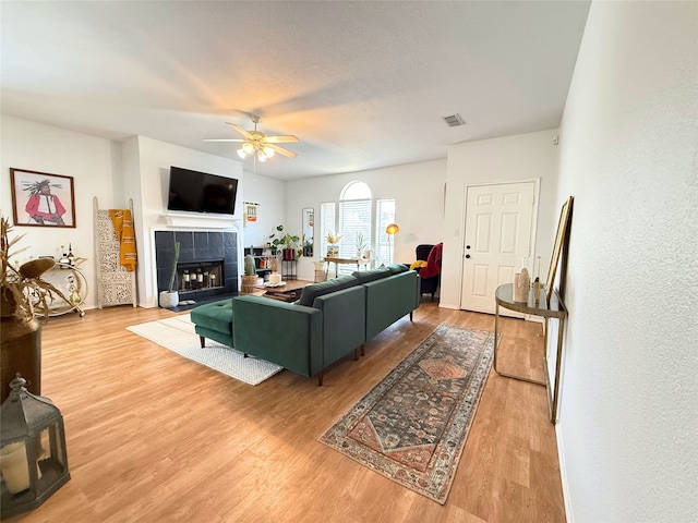 3541 Cripple Creek Trl, Fort Worth, TX 76262 - living room with a ceiling fan, wood finished floors, and a fireplace