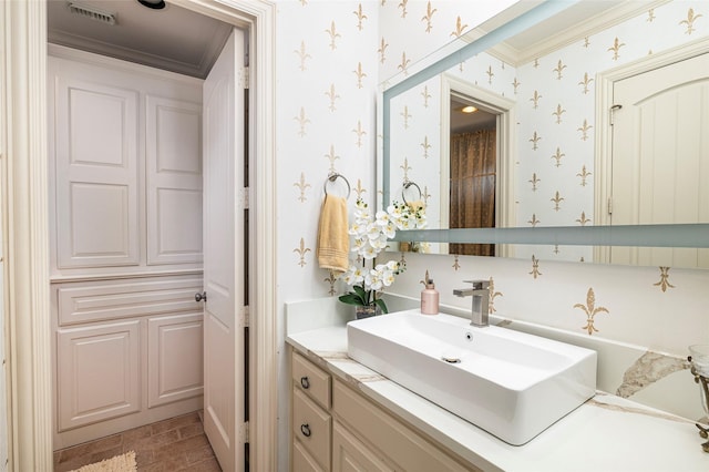 5332 Longvue Dr, Frisco, TX 75034 - bathroom featuring vanity, crown molding, and wallpapered walls