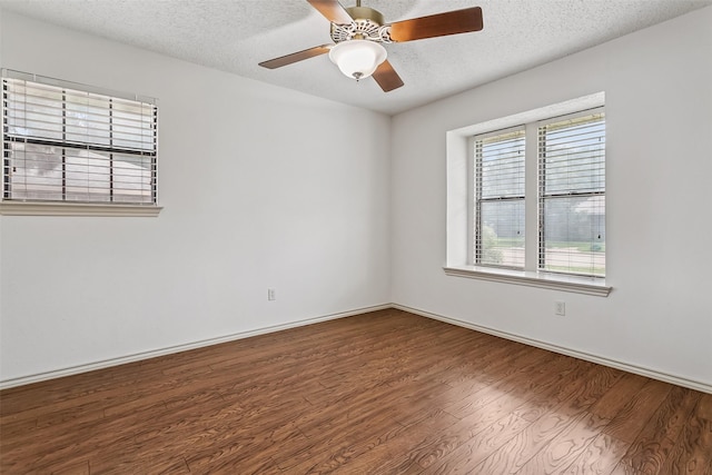 2526 Axminster Dr, Grand Prairie, TX 75050 - spare room featuring wood finished floors, a textured ceiling, and a ceiling fan