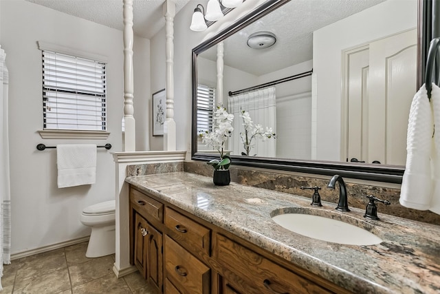2526 Axminster Dr, Grand Prairie, TX 75050 - bathroom with a textured ceiling, vanity, a shower with curtain, and tile patterned flooring