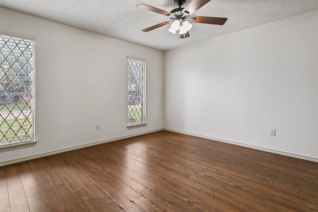 2526 Axminster Dr, Grand Prairie, TX 75050 - spare room featuring hardwood / wood-style floors, ceiling fan, and a textured ceiling