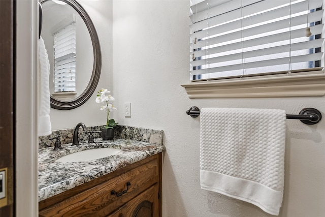 2526 Axminster Dr, Grand Prairie, TX 75050 - bathroom featuring vanity and a textured wall