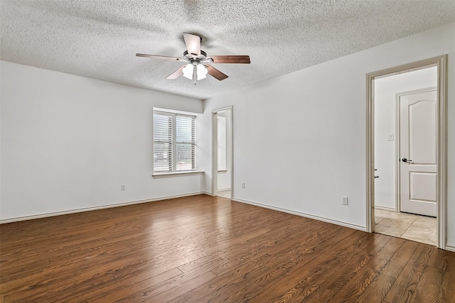 2526 Axminster Dr, Grand Prairie, TX 75050 - unfurnished room with wood finished floors, a ceiling fan, and a textured ceiling