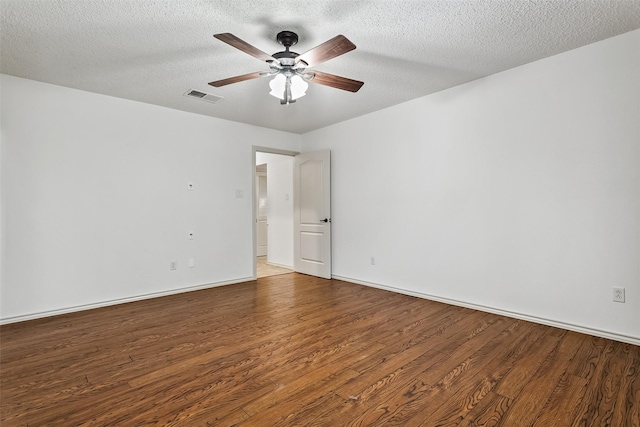 2526 Axminster Dr, Grand Prairie, TX 75050 - unfurnished room with wood finished floors, a ceiling fan, and a textured ceiling