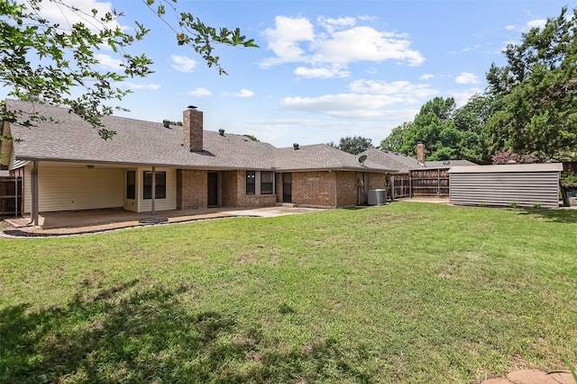 2526 Axminster Dr, Grand Prairie, TX 75050 - rear view of property featuring a patio area, a chimney, brick siding, and roof with shingles