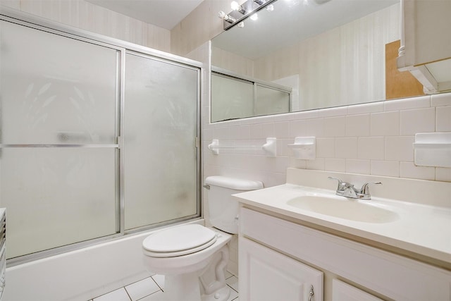 302 S Fox Ln, Burleson, TX 76028 - full bath with vanity, tile walls, shower / bath combination with glass door, and tile patterned floors