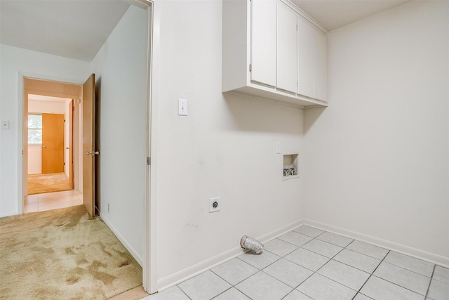 302 S Fox Ln, Burleson, TX 76028 - washroom featuring hookup for a washing machine, electric dryer hookup, cabinet space, and light tile patterned flooring