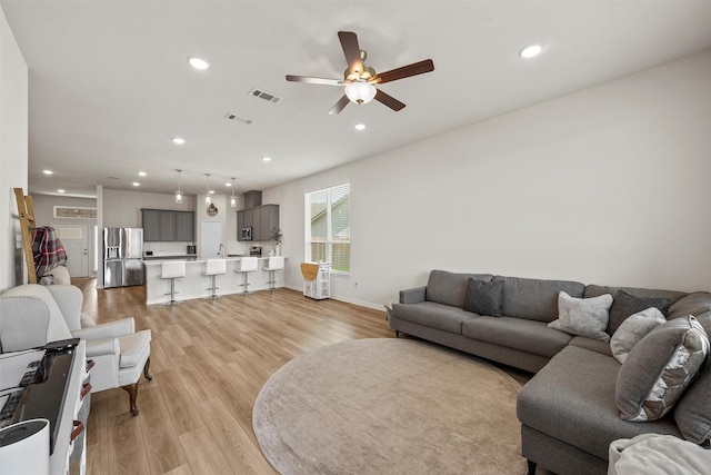 3401 Beutel Rd, Lorena, TX 76655 - living area with light wood-style floors, ceiling fan, and recessed lighting