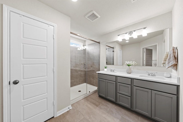 3401 Beutel Rd, Lorena, TX 76655 - full bathroom with double vanity, a shower stall, and tile patterned flooring