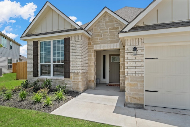 3401 Beutel Rd, Lorena, TX 76655 - entrance to property with board and batten siding, brick siding, roof with shingles, stone siding, and a garage