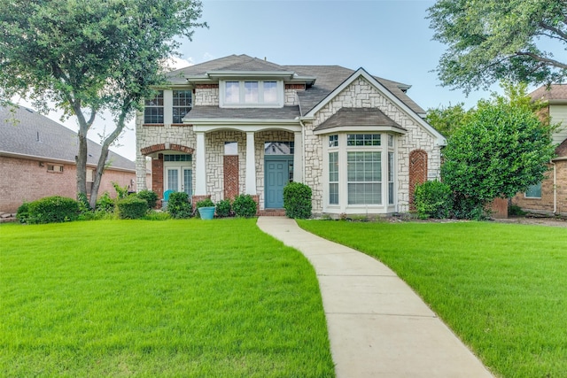 11398 Pear Ridge Dr, Frisco, TX 75035 - view of front of property featuring a front lawn, stone siding, and a shingled roof
