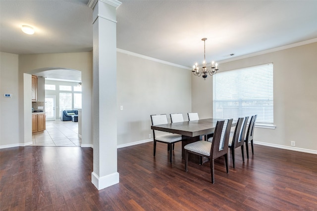 11398 Pear Ridge Dr, Frisco, TX 75035 - dining room featuring arched walkways, wood finished floors, a chandelier, and ornamental molding