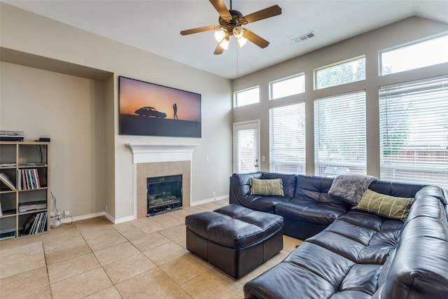 11398 Pear Ridge Dr, Frisco, TX 75035 - living area featuring a ceiling fan, light tile patterned flooring, and a tile fireplace