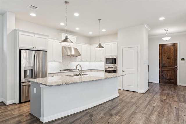 905 Plaza Ln, Argyle, TX 76226 - kitchen featuring stainless steel appliances, range hood, white cabinets, ornamental molding, and tasteful backsplash