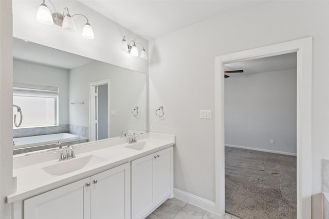 905 Plaza Ln, Argyle, TX 76226 - bathroom featuring double vanity, a garden tub, and tile patterned flooring