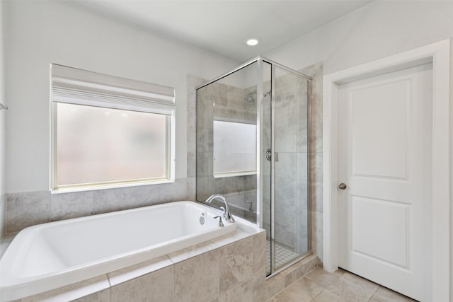 905 Plaza Ln, Argyle, TX 76226 - full bathroom featuring a garden tub, a stall shower, and tile patterned flooring