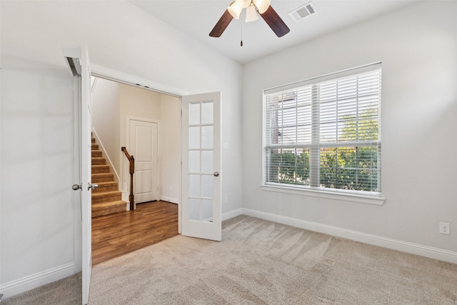 905 Plaza Ln, Argyle, TX 76226 - unfurnished room featuring carpet flooring, a ceiling fan, stairs, and french doors