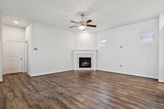 905 Plaza Ln, Argyle, TX 76226 - unfurnished living room with ceiling fan, dark wood-style flooring, a lit fireplace, and recessed lighting