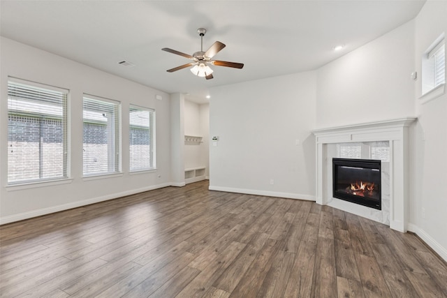 905 Plaza Ln, Argyle, TX 76226 - unfurnished living room with ceiling fan, wood finished floors, a tile fireplace, and recessed lighting