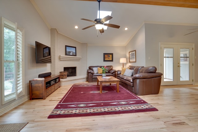 2086 Breezywood Dr, Flower Mound, TX 75022 - living area featuring vaulted ceiling, ornamental molding, plenty of natural light, ceiling fan, and french doors