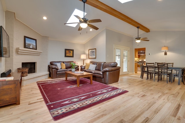 2086 Breezywood Dr, Flower Mound, TX 75022 - living room with a ceiling fan, light wood finished floors, a brick fireplace, and recessed lighting
