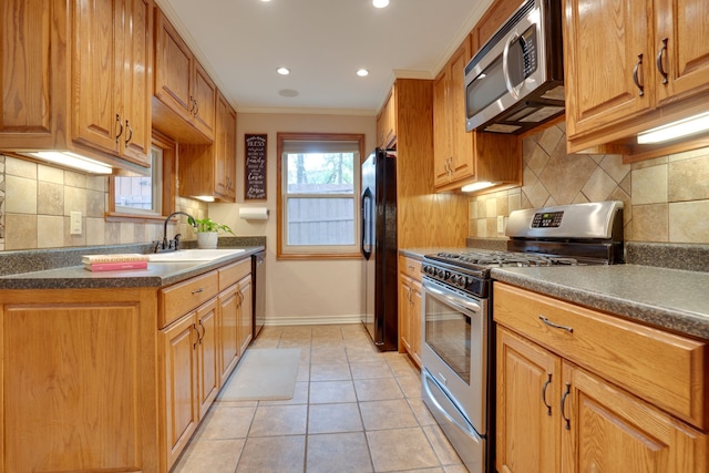 2086 Breezywood Dr, Flower Mound, TX 75022 - kitchen with appliances with stainless steel finishes, ornamental molding, dark countertops, decorative backsplash, and light tile patterned floors