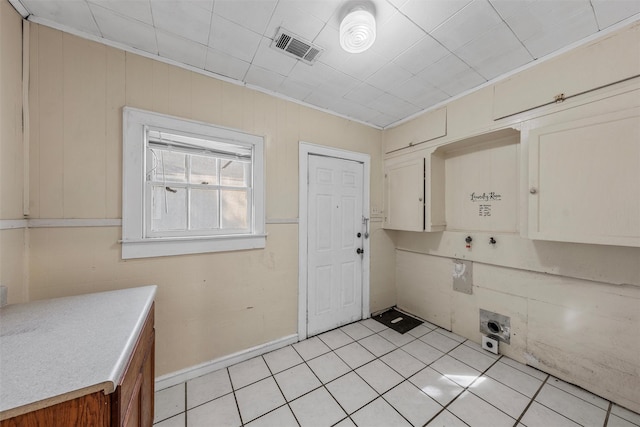 526 N 16th St, Waco, TX 76707 - laundry room featuring cabinet space and light tile patterned flooring