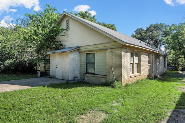 526 N 16th St, Waco, TX 76707 - view of home's exterior featuring brick siding and a lawn
