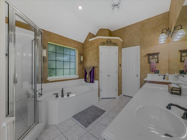 10353 W Dublin Dr, Forney, TX 75126 - bathroom featuring tile patterned floors, a shower stall, a garden tub, vaulted ceiling, and double vanity
