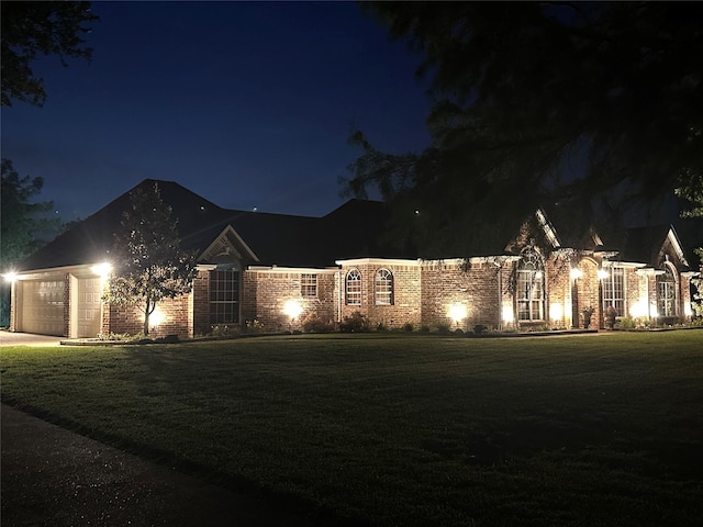 10353 W Dublin Dr, Forney, TX 75126 - view of front of home featuring brick siding, a garage, concrete driveway, and a lawn