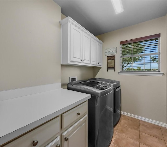 10353 W Dublin Dr, Forney, TX 75126 - laundry room with cabinet space, washing machine and dryer, and light tile patterned floors