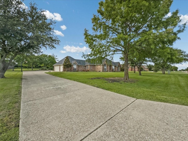 10353 W Dublin Dr, Forney, TX 75126 - view of front of property featuring a garage, concrete driveway, and a front lawn