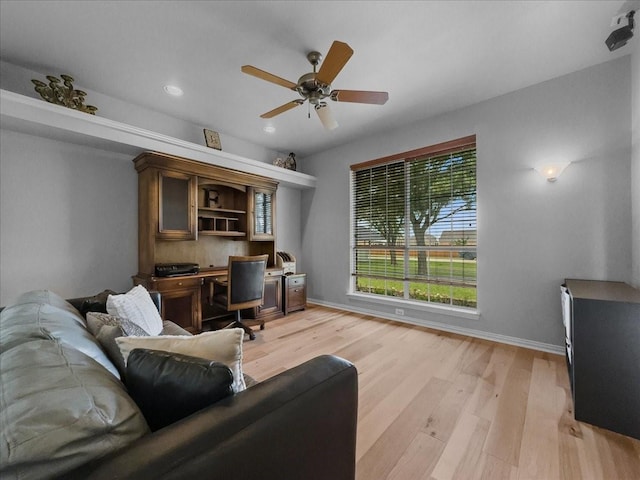10353 W Dublin Dr, Forney, TX 75126 - office area with light wood finished floors, a ceiling fan, recessed lighting, and built in desk