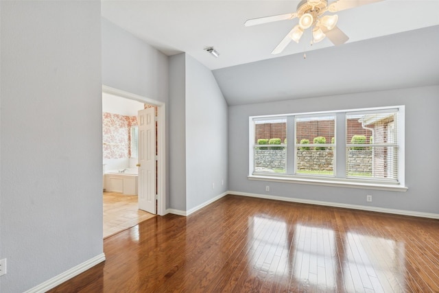 4069 White Porch Rd, Plano, TX 75024 - spare room with vaulted ceiling, wood finished floors, and a ceiling fan