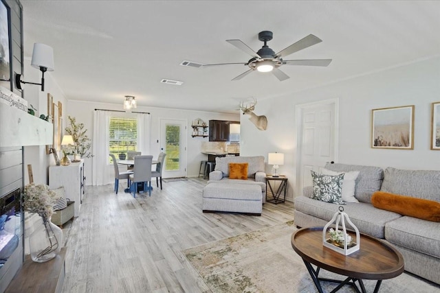 900 Amy Way, Bonham, TX 75418 - living room with light wood-style floors and ceiling fan
