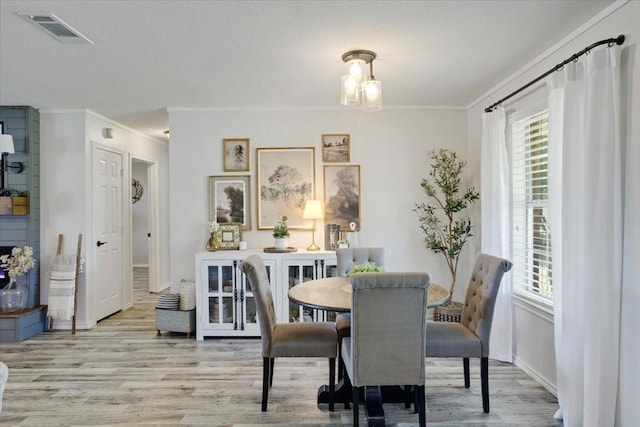 900 Amy Way, Bonham, TX 75418 - dining space with ornamental molding and wood finished floors
