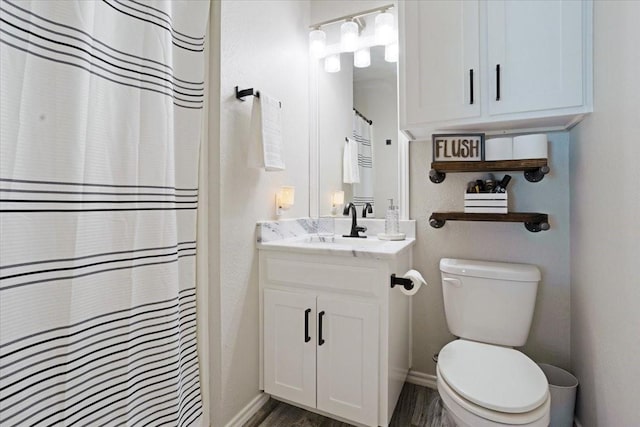 900 Amy Way, Bonham, TX 75418 - full bathroom featuring vanity, wood finished floors, and curtained shower