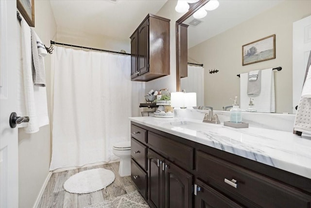 900 Amy Way, Bonham, TX 75418 - bathroom featuring vanity and wood finished floors